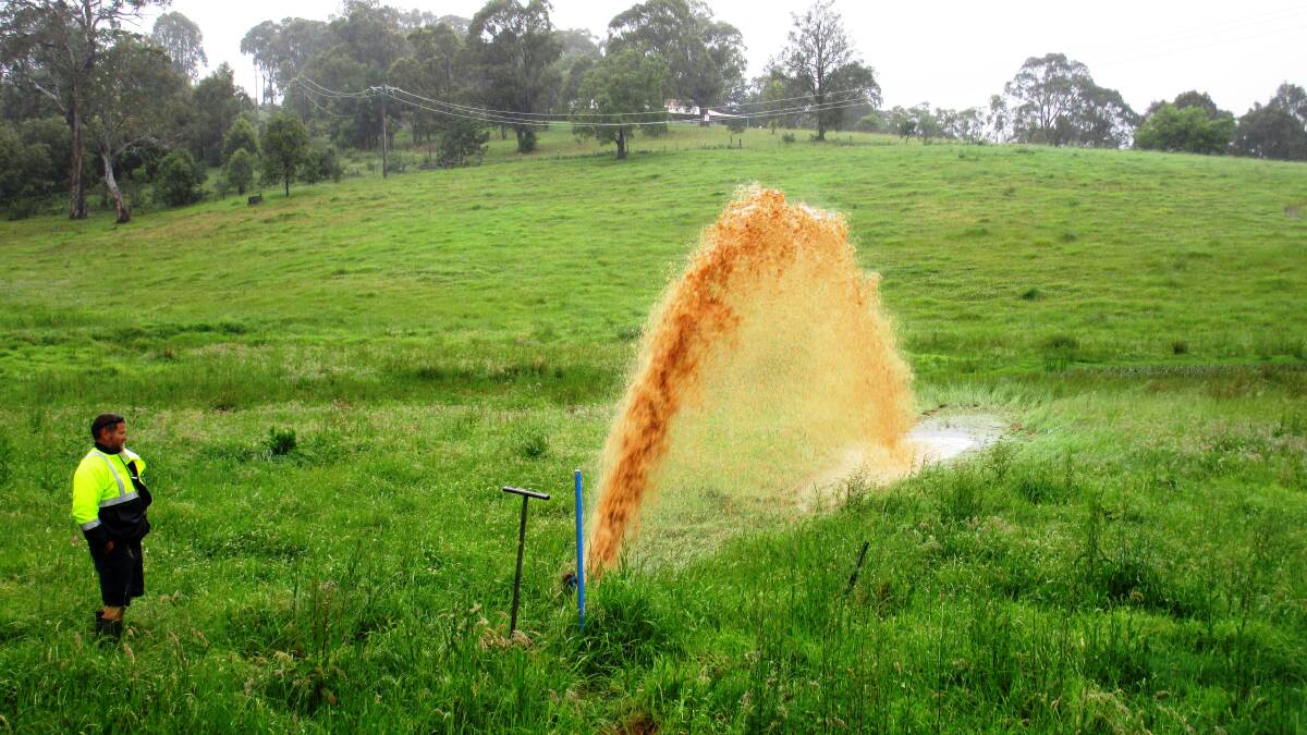Bega Water and Sewer Services team member Scott Reeve flushes the water main between Bega and Tathra.