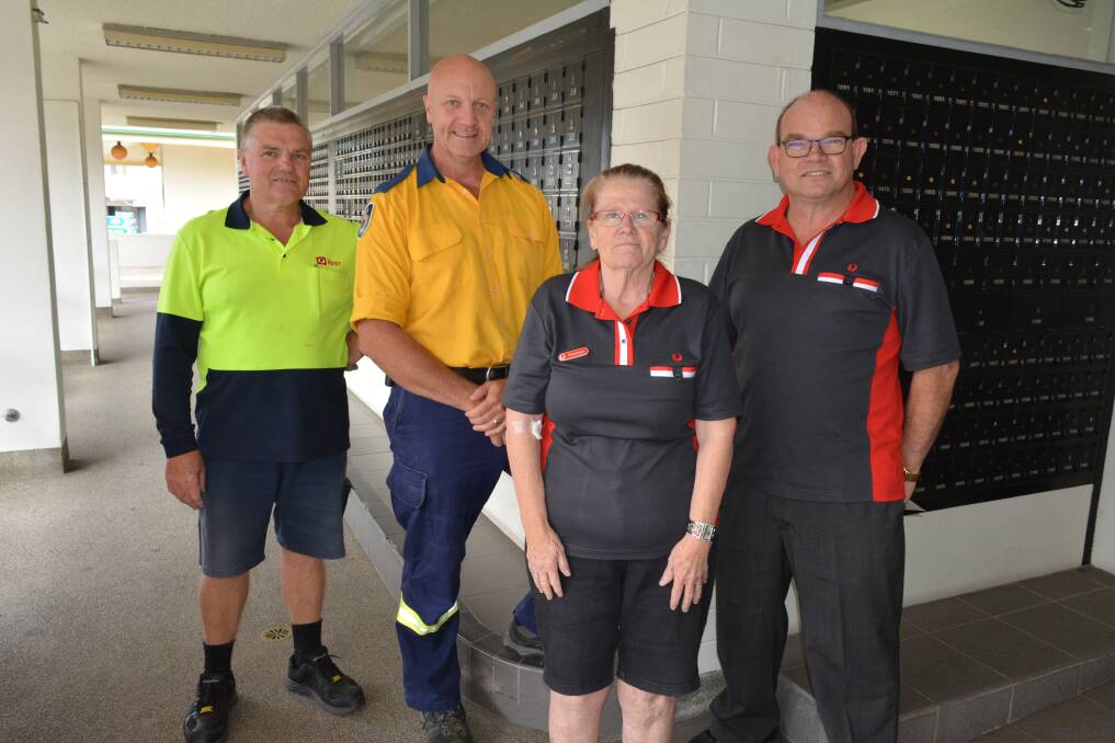 SEALED AND DELIVERED: Presenting a donation to Garry Cooper from the Angledale-Stony Creek RFS are Max Williams, Rosemary Williams and Peter Truscott from the Bega Post Office. Photo: Ben Smyth