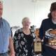Jack Pollock, 15-year-old member from Greigs Flat, is awarded the annual 2021-22 NSW GFA Southern Zone Yellowfin Tuna trophy by president Steve Lamond and secretary Sanchia Glaskin.