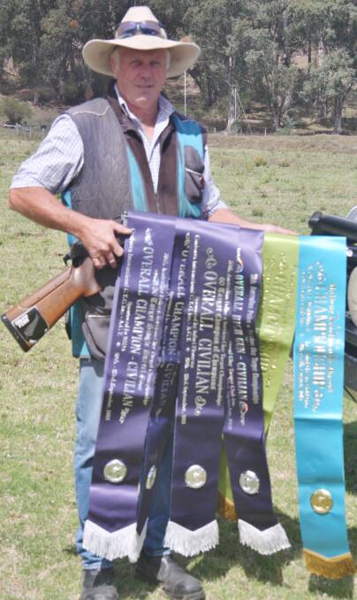 TOP GUN: Bega Gun Club member Charlie Smith shows off his swag of ribbons from successful shoots at Cowra and Canberra.