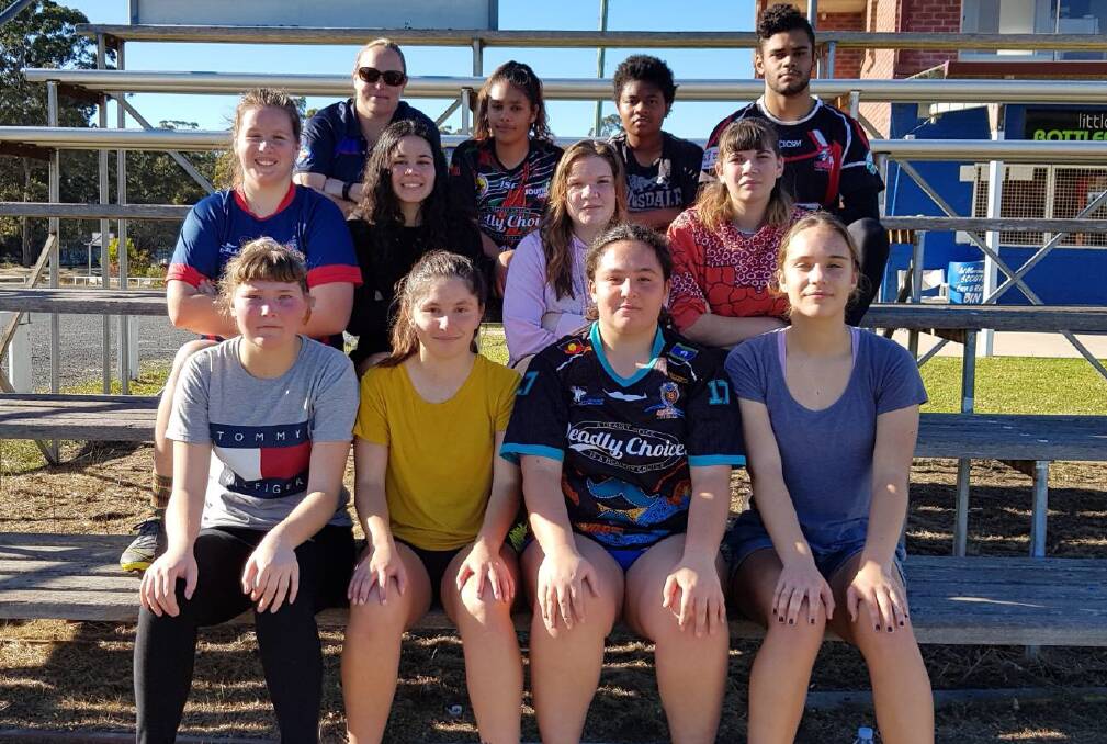 REPRESENT: Senior Constable Sarah Bancroft (back left) and volunteer trainer Darnell Andy (back right) with the inaugural Nations of Origin Yuin Ducks under 16 girls league sevens squad.