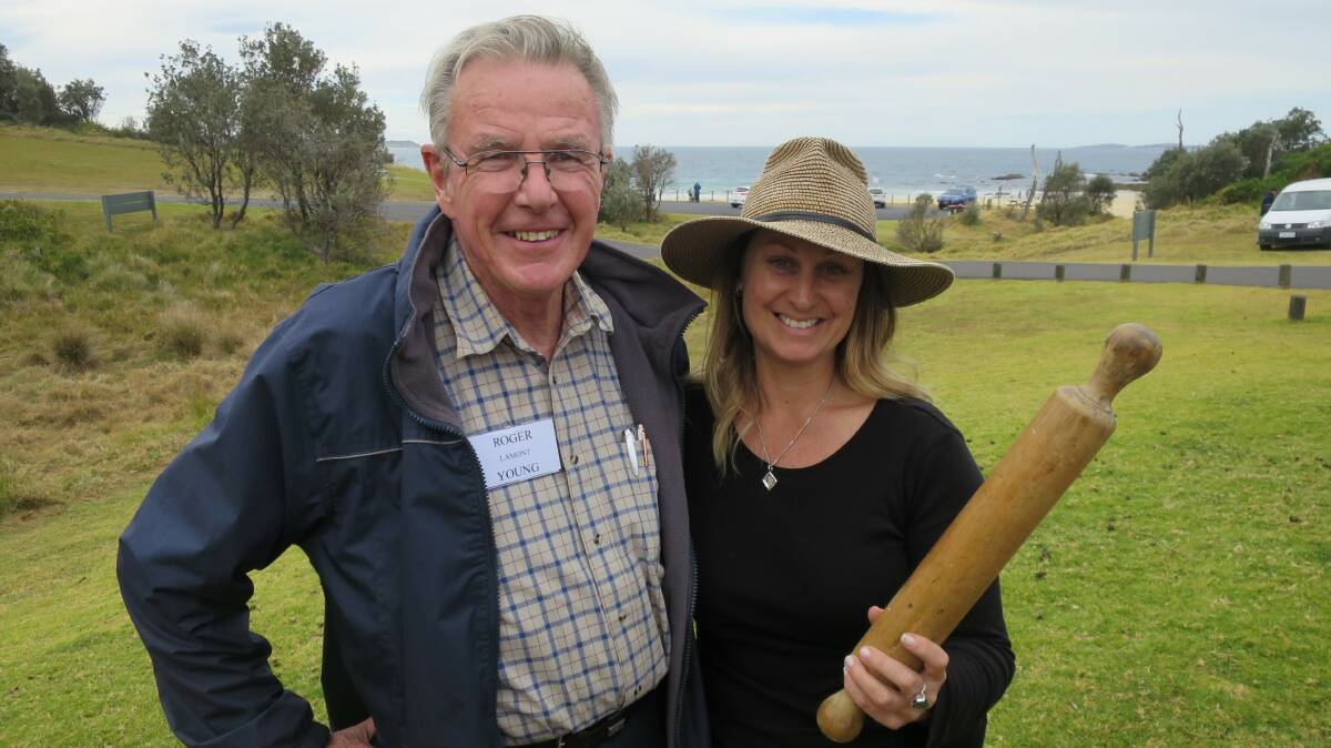 Holding a rolling pin believed to have been fashioned by Corunna selector John Josiah Poole from one of the paddles from Tom Towers' boat wrecked on Corunna Point is a descendant Lee-Anne Eddie. With her is John Lamont Young, a descendant of Lamont Young, the surveyor who disappeared. The rolling pin was given to the Bermagui Museum by Mark Hunter, another Poole descendant.