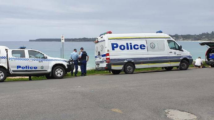 Police attend a beach at Mollymook on Saturday after members of the public found remains thought to be human. Photo: TNV