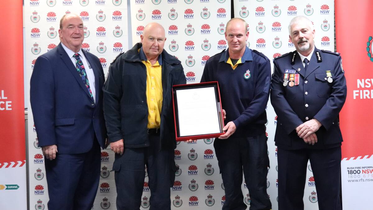 Bemboka Rural Fire Brigade Captain, John Inskip and Firefighter Andrew Inskip receive the Commissioners Certificate of Commendation from Bega Valley Mayor Russell Fitzpatrick and Superintendent Angus Barnes.
