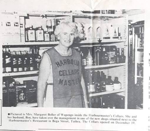 The caption reads: Mrs Margaret Boller of Wapengo inside the Harbourmaster's Cellars. She and her husband Ben have taken over the management in one of the new shops situated next to the Harbourmaster's Restaurant in Bega St, Tathra. 