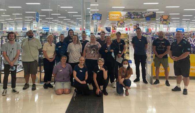 The team at Big W receives a replacement trophy for their Bega Customer Service Excellence win after the original one broke during February's awards night.