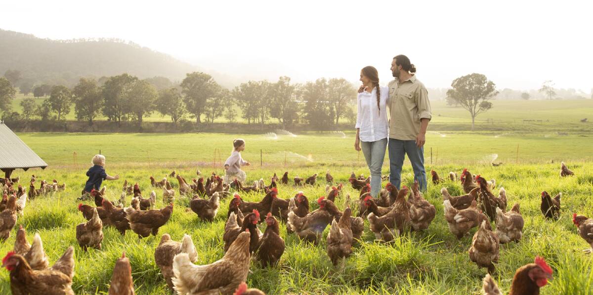 Bega Valley Eggs' Tom and Joscelin McMillan with their children and their chooks. Photo supplied