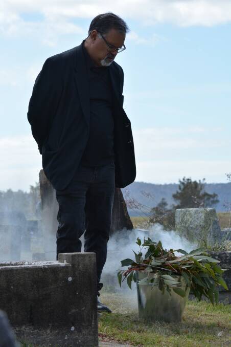 David Dixon performs a smoking ceremony at the dedication service. Picture by Ben Smyth