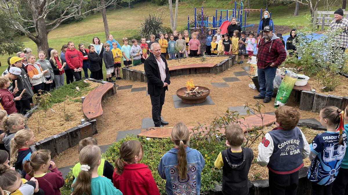 Wolumla Public School principal Peter Claxton and Uncle John Dixon welcome students, staff and guests to the launch of the school's yarning circle and bush tucker garden on August 4. Photo: Ben Smyth