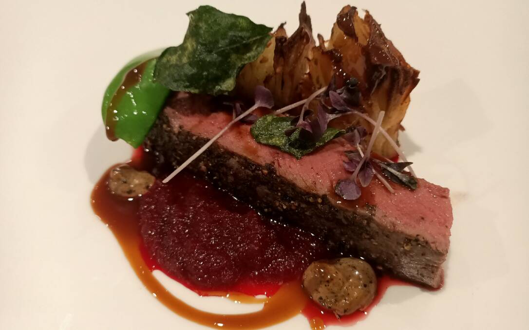 Mountain pepper and salt bush lamb loin with beetroot puree, black garlic and pommes anna. Photo: Ben Smyth