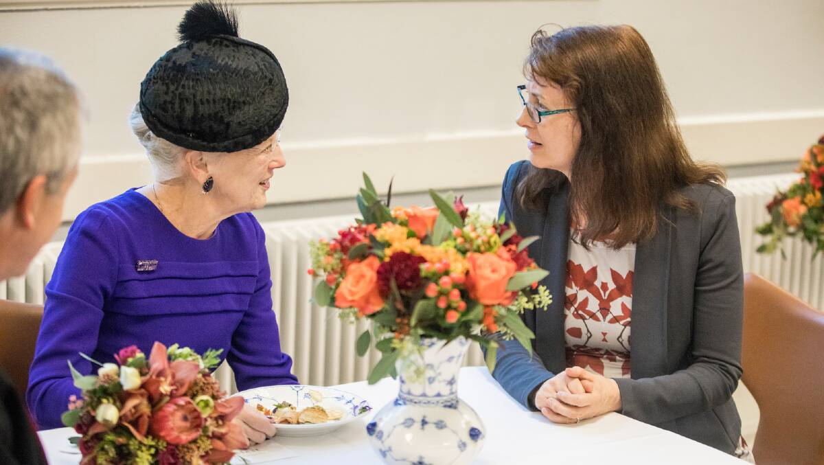 TEA WITH THE QUEEN: Professor Deborah Lupton has a conversation with Queen Margrethe II of Denmark as part of the honorary doctorate presentation ceremony.