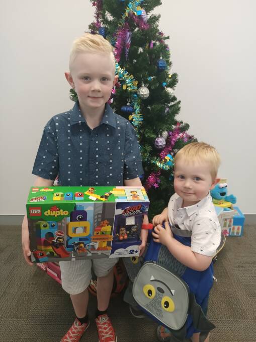 Conor and Ari Lynn donate gifts to the Christmas Toy Appeal purchased with their own pocket money.