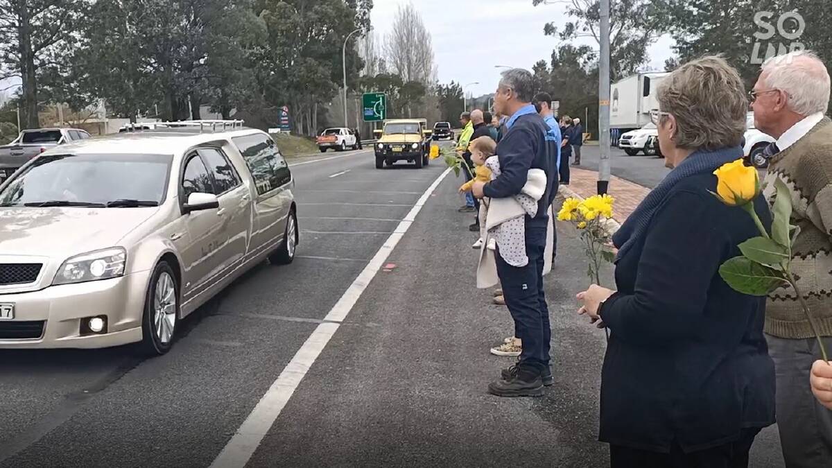 HONOUR: Michael Shipton's funeral procession is marked by a guard of honour along the highway at Bega on Monday.