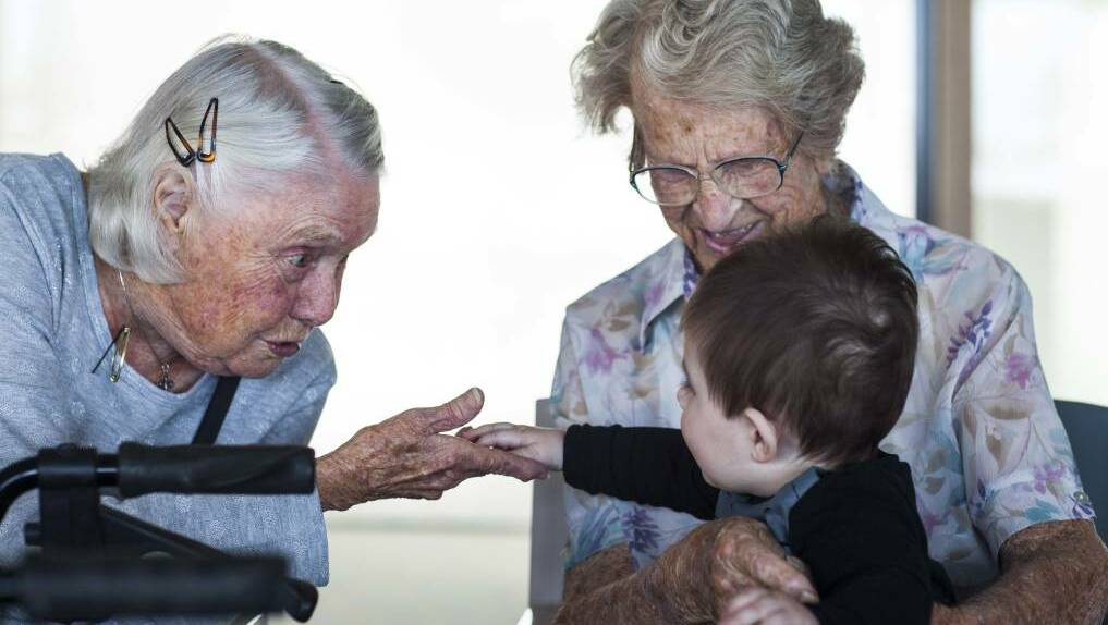 Residents at Albert Moore Gardens enjoy the company of youngsters during the playtime session aimed at connecting elderly and young children. Photo: Rachel Mounsey