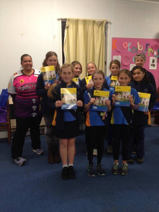 HOME DELIVERY: The Bega Girl Guides pictured with this year's phone book, which they have been busily distributing to residents and business throughout Bega.