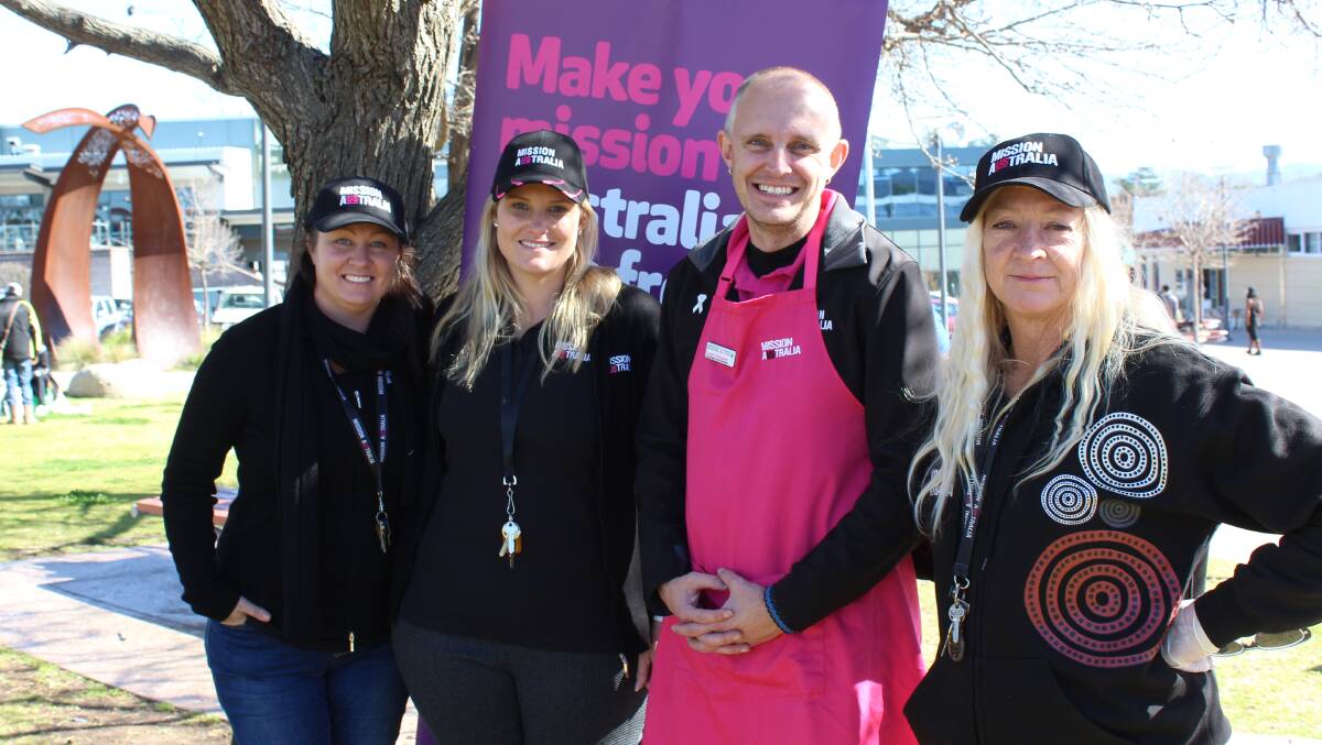 Mission Australia's Linda Leonard, Danielle Smith, Daniel Strickland and Gabrielle Rosengren hold a free sausage sizzle for Homelessness Week in Bega on Thursday. 