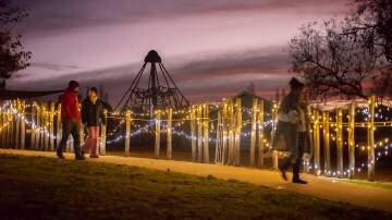 Families arrive at dusk for the Winter Festival Spiral Walk