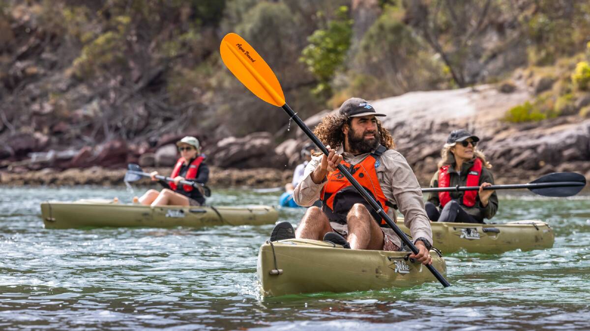 Cultural educator Nathan Lygon leads a Navigate Expeditions Cultural Kayak tour along the Pambula River. Picture by David Rogers