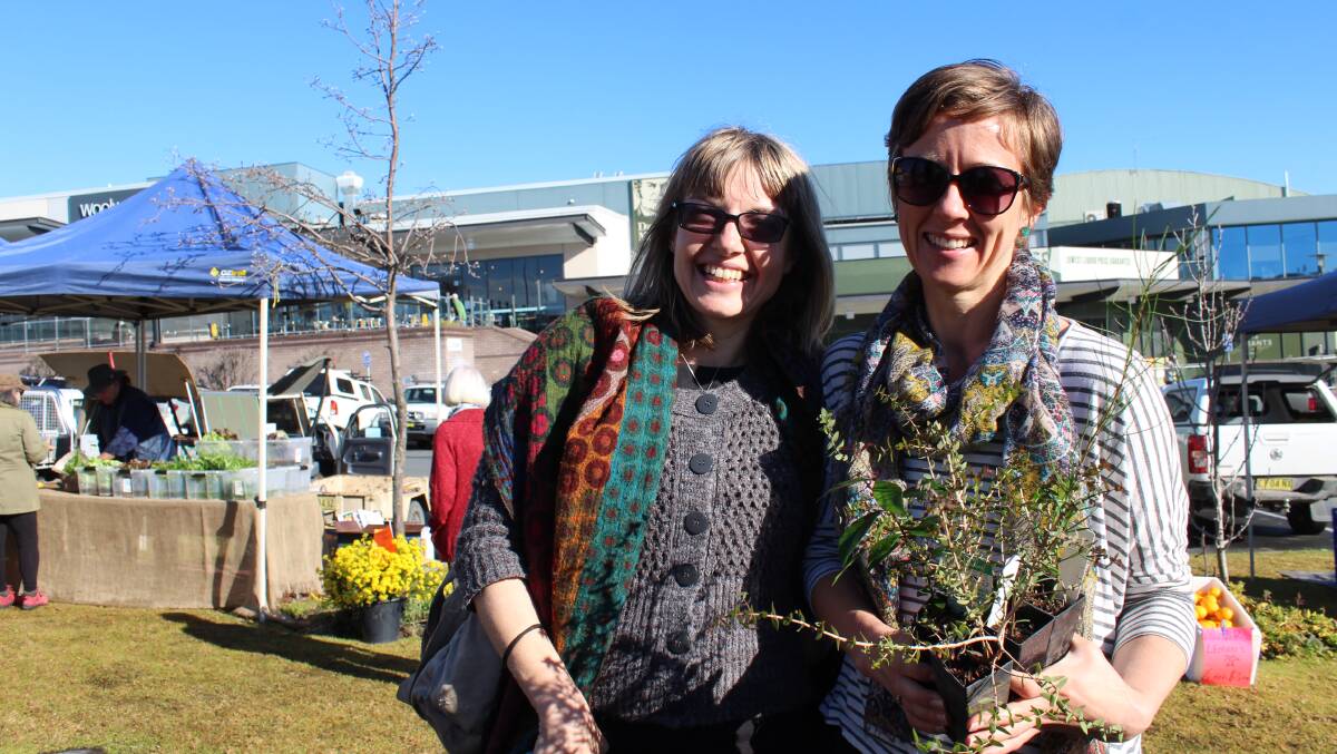 Worth the wait: Vanessa Milton and Louise Smith braved the queue to pick up their free trees at the Bega Valley Shire Council giveaway on Friday. Photo: Alana Beitz