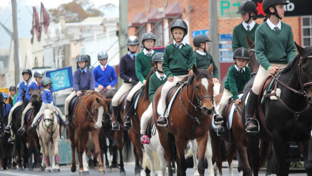 Young riders from across the South East enjoy the annual Bega Pony Club camp parade along Carp St on Saturday morning.