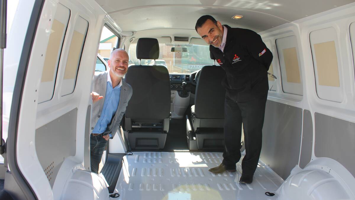ACM sales manager Tim Shinnick and Tarra Motors director John Stylianou check out the newly delivered van, to be converted into a mobile laundry. Photo: Ben Smyth