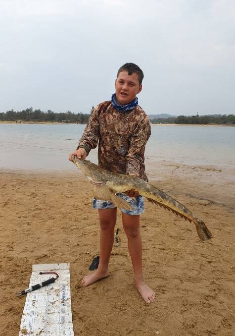 Is this Godzilla? 13-year-old junior angler Tyler Breust from Bega shows off his magnificent 94cm catch and release dusky flathead at Mogareeka taken from the shore using a poddy mullet bait.
