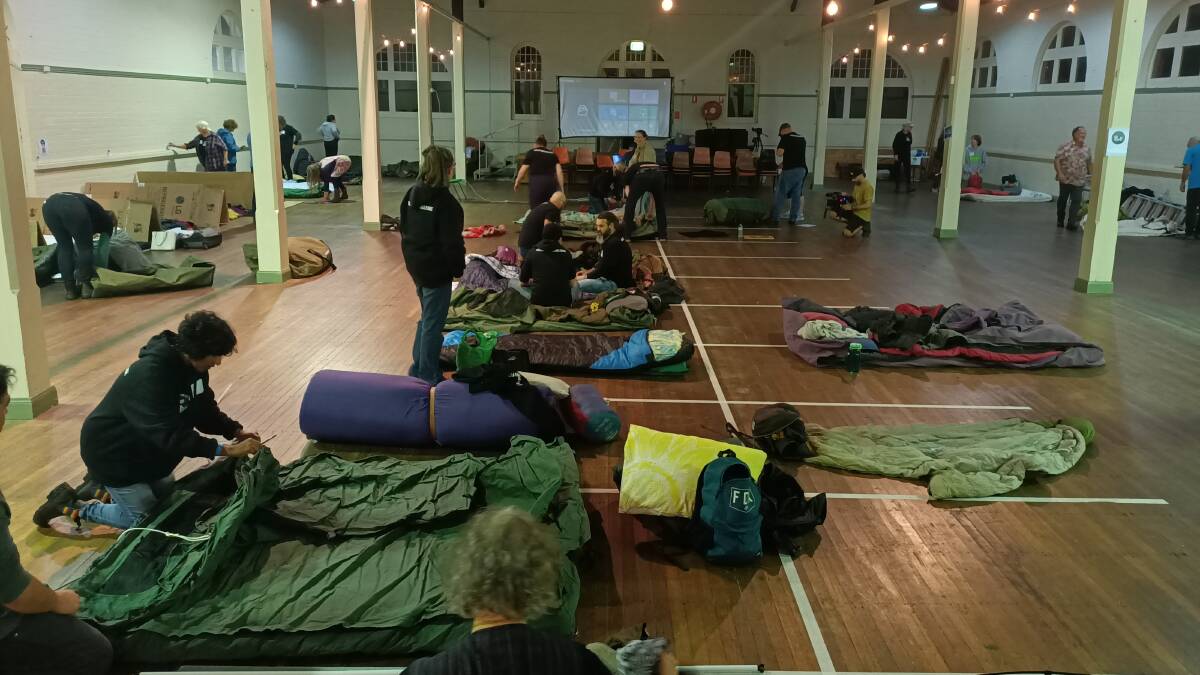 Bedding down for the night in the Bega Showground pavilion for the Sleep On It Challenge. Photo: Ben Smyth
