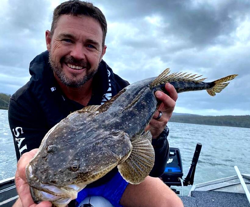 CATCH OF THE DAY: Local angler Andrew Badullovich shows a great ugly dusky flathead taken on a soft vibe lure in Merimbula Lake and released alive and well.