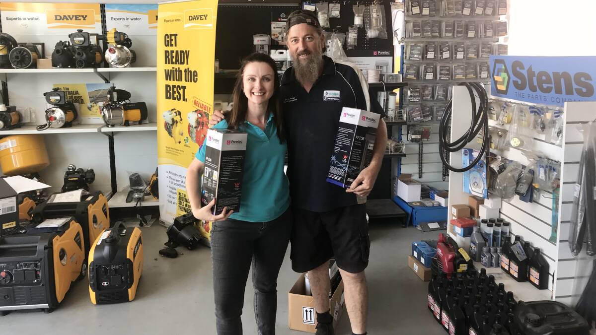 Caroline Odgers, regional manager of GIVIT with Baz from Baz's Pumps Bega and some donated water filters.
