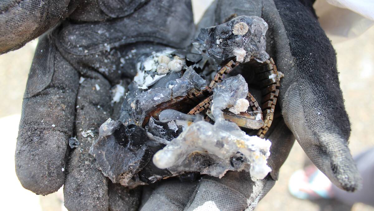 Molten jewellery found by Team Rubicon as they sifted through properties in Tathra as part of a huge clean-up effort following the March 18 bushfire. Picture: Alana Beitz