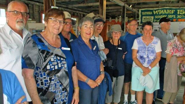 A recent group of visitors on a 12-day tour from Newcastle to Flinders Island stop by the Tathra Wharf Museum. Photo: Allen Collins