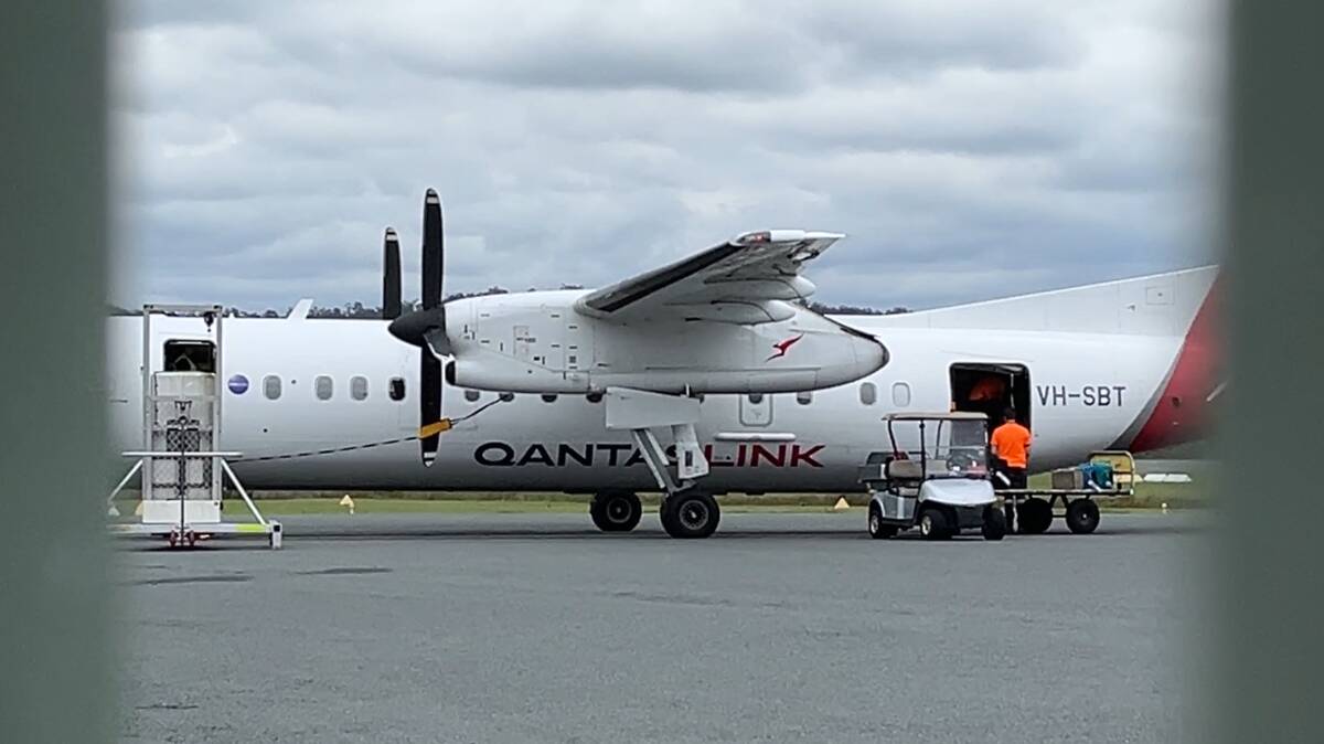 A QantasLink plane on the tarmac at Merimbula Airport. Picture by James Parker