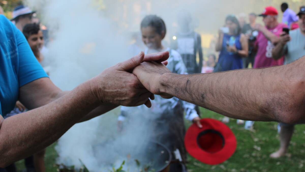 There was a great sense of friendship and acceptance at the refugee event on Saturday, which included a traditional Indigenous smoking ceremony.