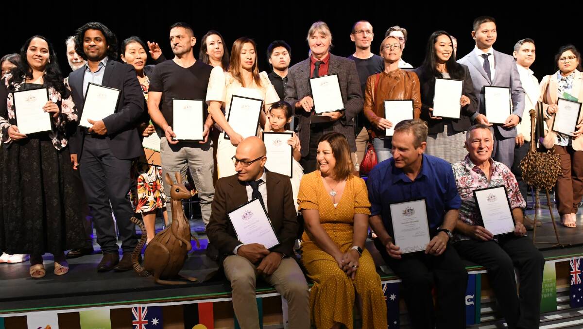New Australian citizens celebrate after taking the pledge. Picture by Ben Smyth