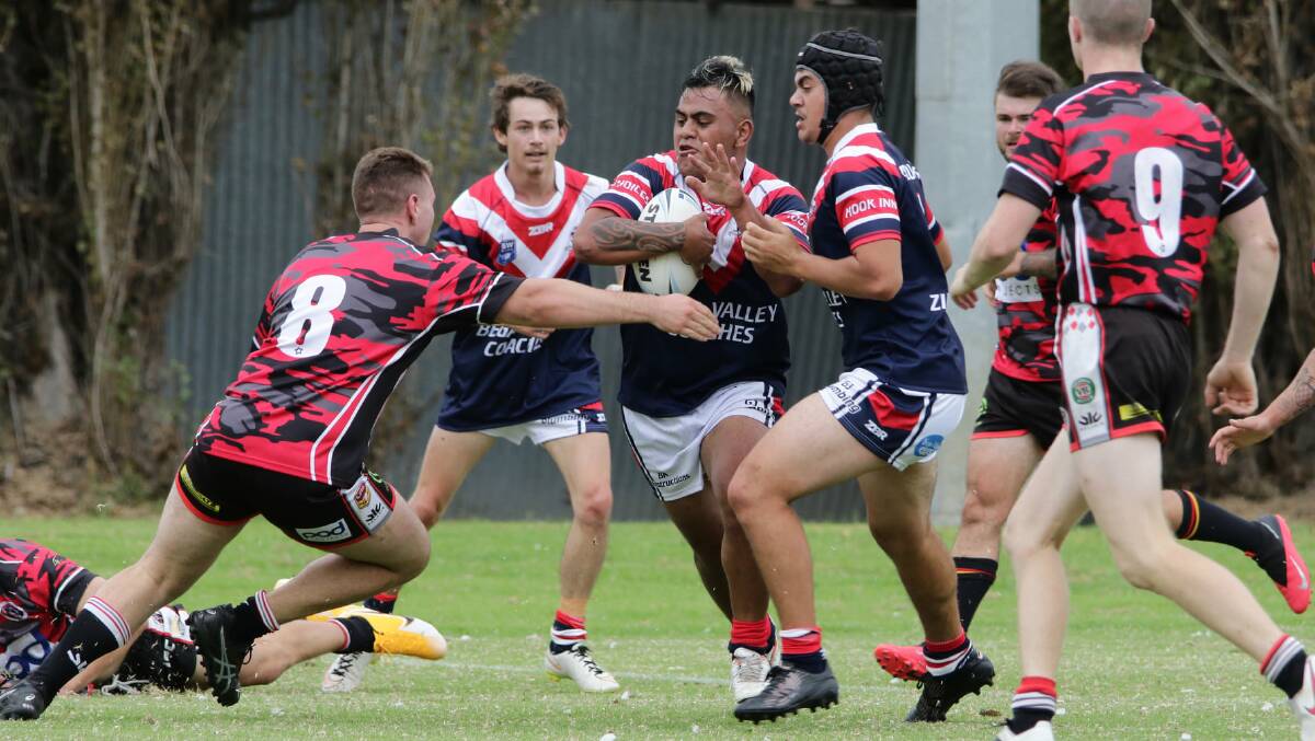 INSPIRING RUN: Bega's new recruits hit the ground running, helping the Roosters to an 18-6 win over North Canberra in Saturday's trial match. Photo: Peter Sheales