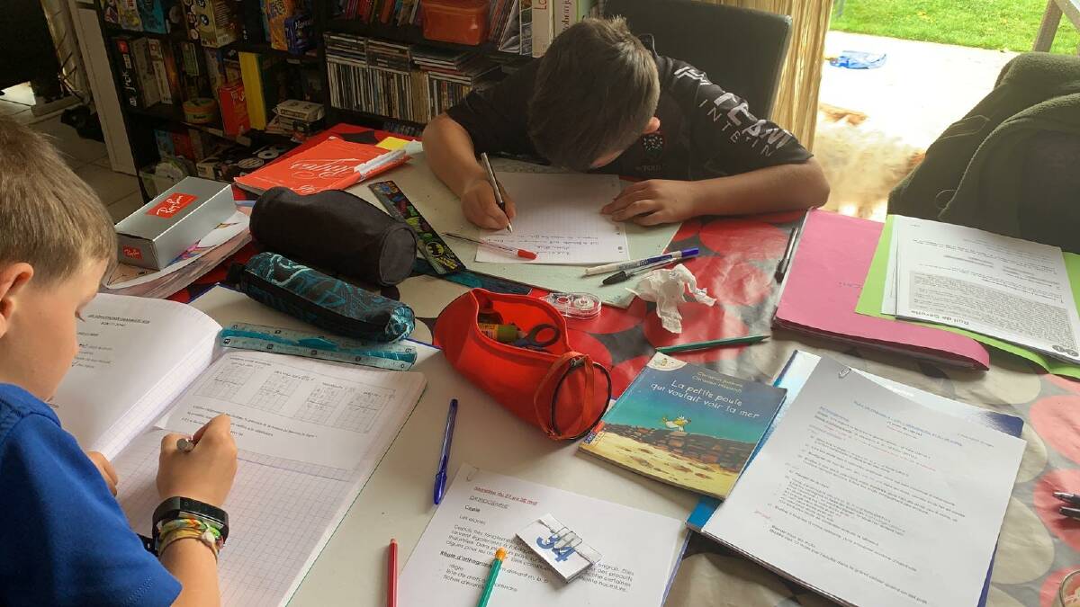 Evan and Yanaël Ditchi doing school work from home. Picture: Céline Ditchi