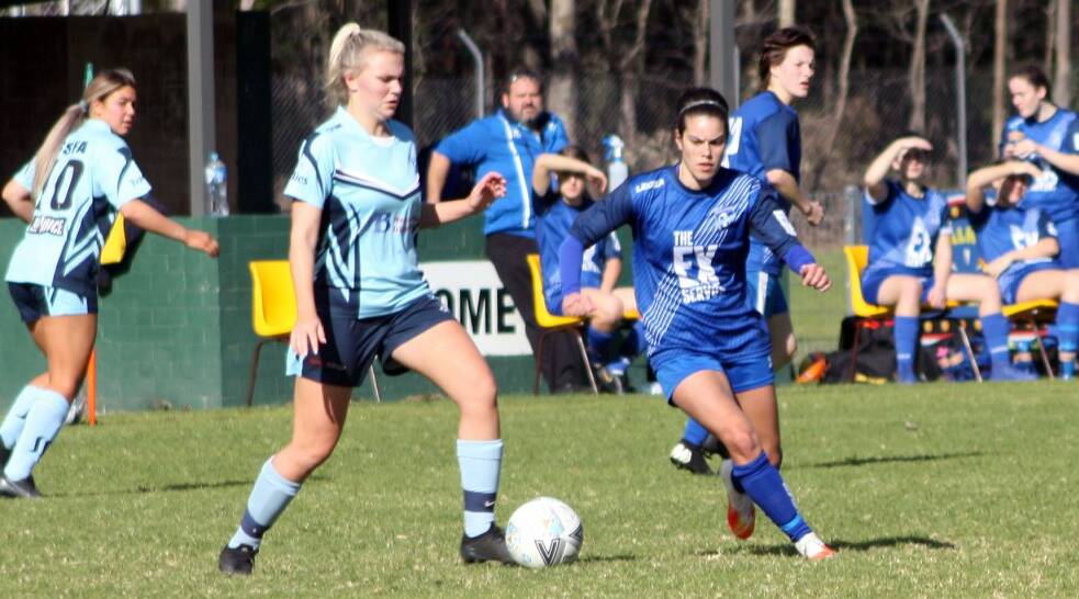 Southern Branch first grade player Amanda Carney attempts to tackle a Sutherland Shire opponent on Sunday. Photo: Freddie Simon
