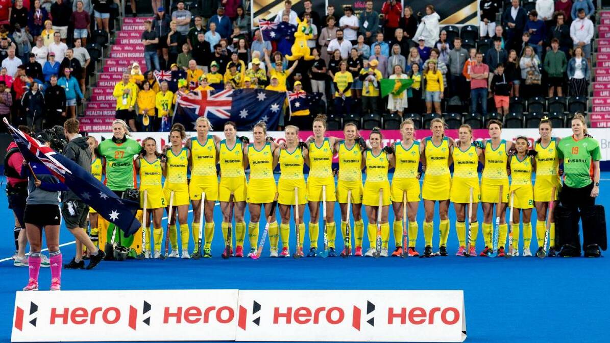 ON A HIGH: Kalindi Commerford (eighth from right) and her Hockeyroos team at the 2018 World Cup. Photo: WORLD SPORTS PICS