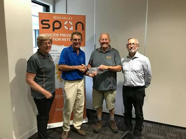 Tura Beach men's golf president Ric Wright presenting a cheque to Greg Miller of Bega Valley SPAN.