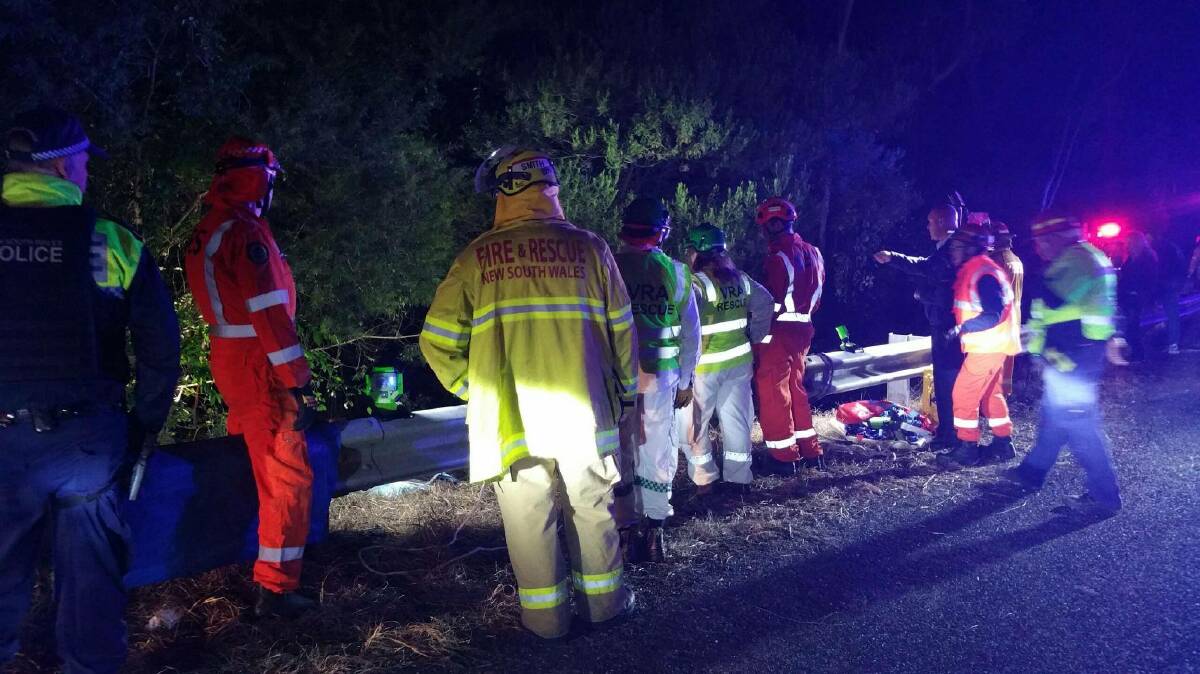 Emergency crews respond to a single-vehicle crash off the Princes Highway, north of Narooma on Thursday, June 6. Picture: NSW Fire and Rescue.