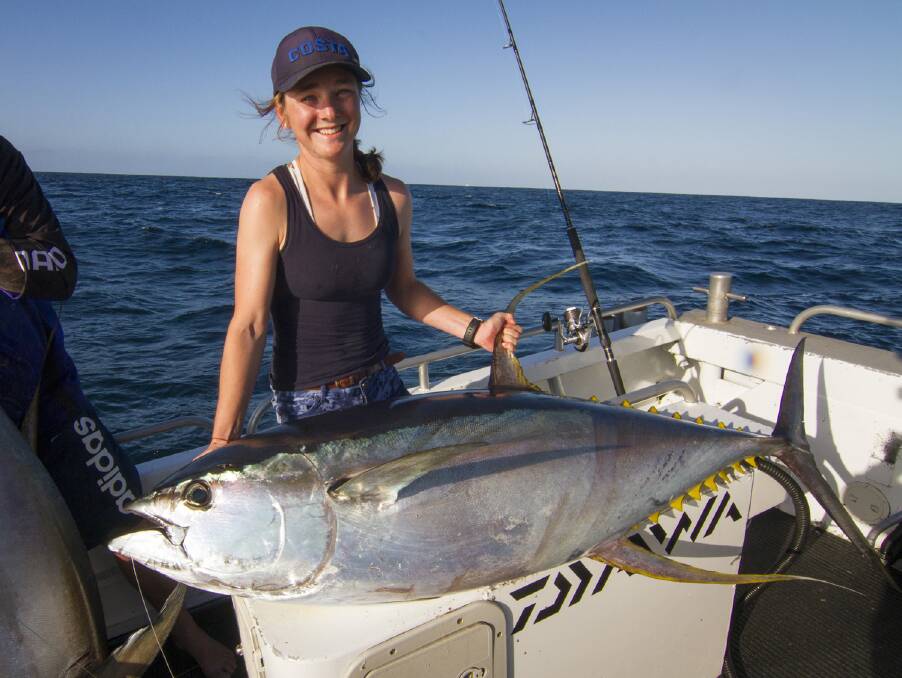 Game on: Dalmeny fisherwoman Georgia Poyner with a 60kg yellowfin tuna she caught off Narooma on April 27. 