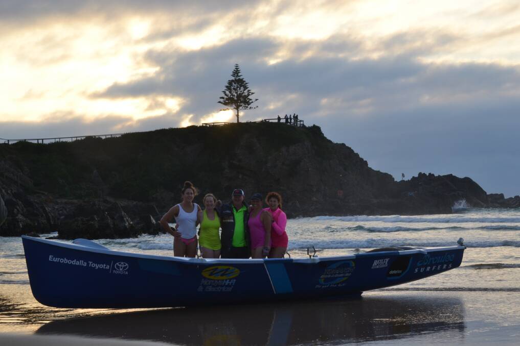 Broulee surf boat crew back safely to the beach after the service. Pictured: Claudia Ferguson, Kerryl Davie, Rob Pollock, Donna Clarke and Sue Dale.