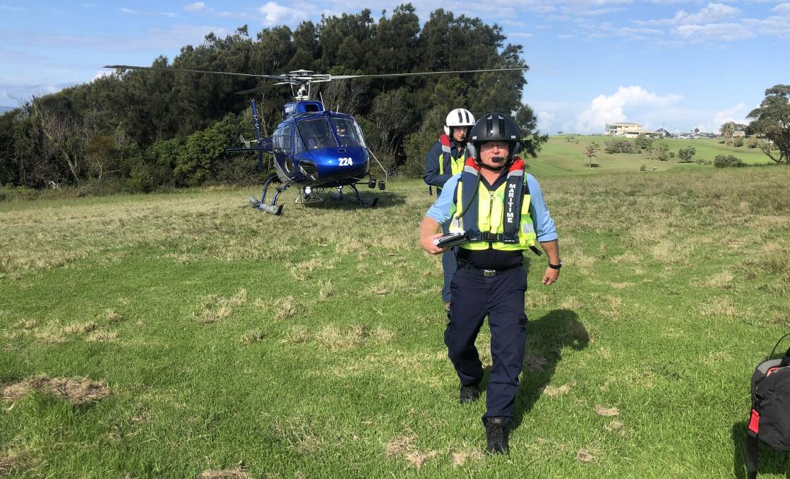 Observers in helicopters are needed to navigate fixed wing aircraft to drop dispersant on the oil slick. Image: Transport for NSW. 