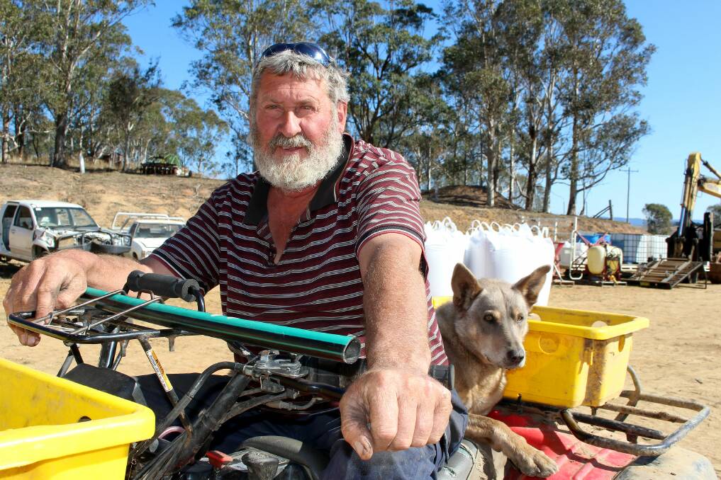 Punter McPaul and his working dog ready to round up cattle on his dairy farm in South Wolumla.
