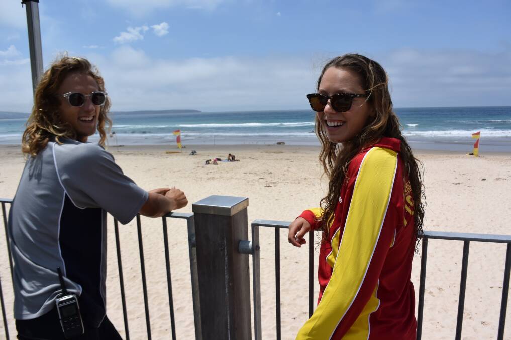 Lifeguard supervisor Will Apps stops in to Pambula Beach where Maddy Harvey keeps an eye on swimmers on Thursday, December 20.