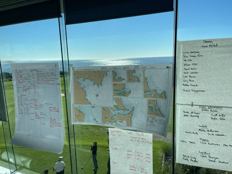 Maps and team lists inside the incident control centre. 