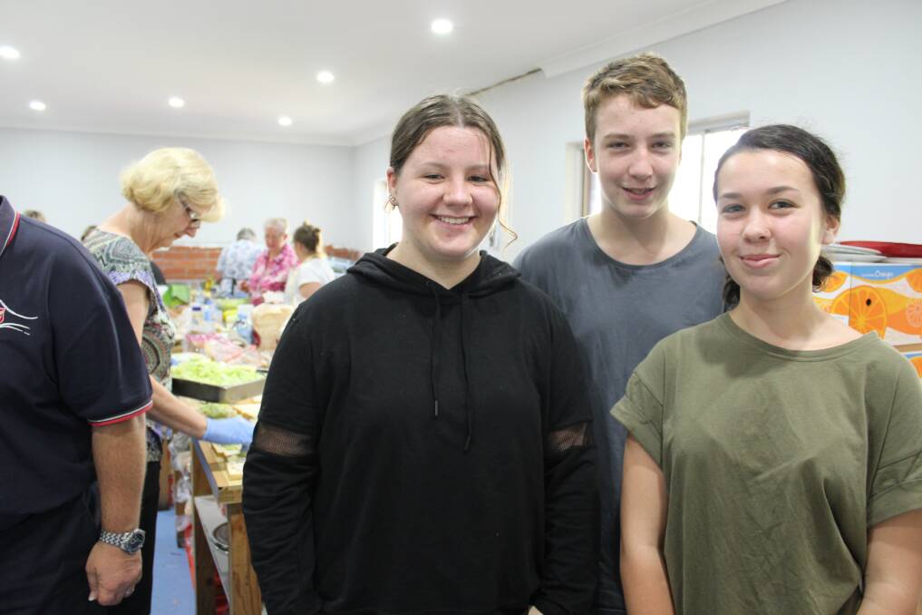 Bega High School students Bella Kilpatrick, Woti Fastigata and Grace Stanger helped at the Bega Showground evacuation centre while their school is closed due to Tathra fire. 