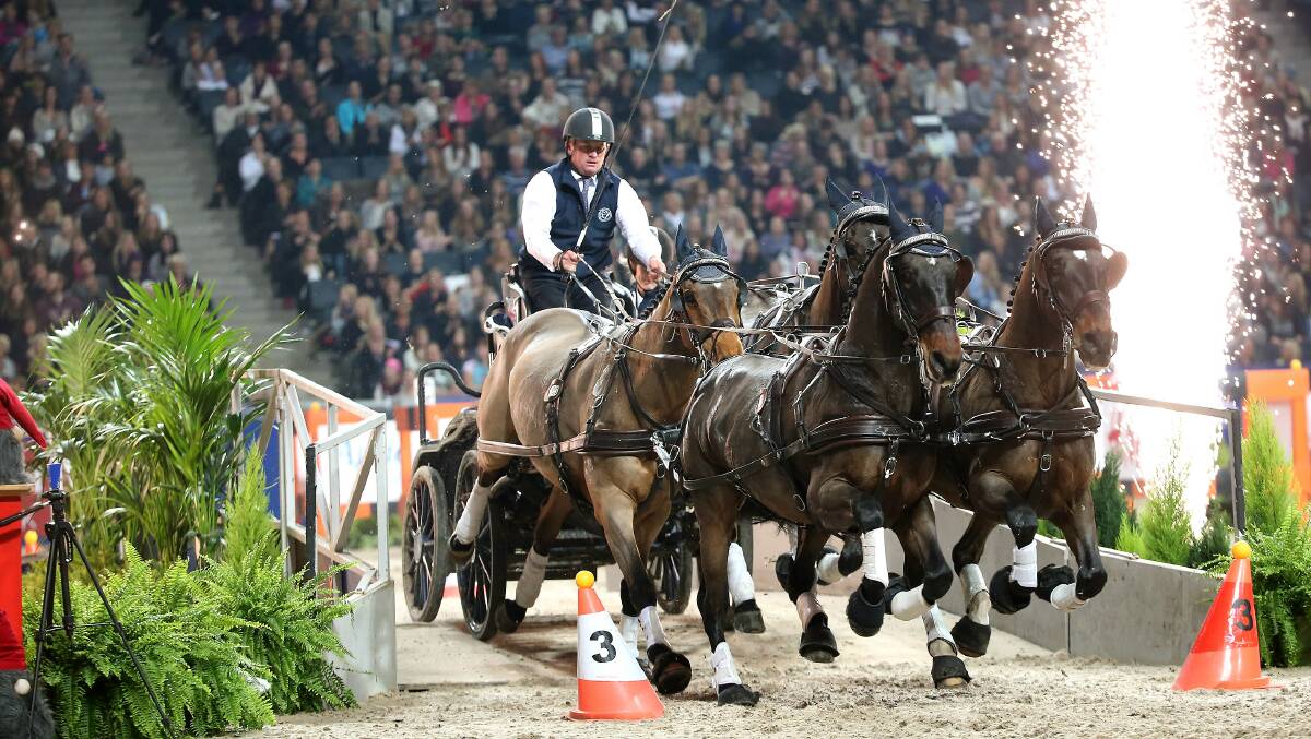 Boyd Exell gracefully leads his team around the track in Stockholm in round two of the World Cup in 2104.  Photo courtesy of Roland Thunholm/FEI.
