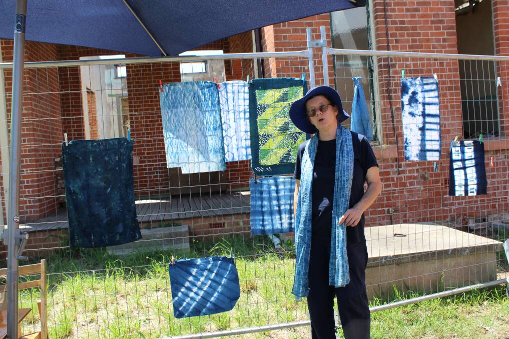 TRUE BLUE: Mog Bremner helped those who wanted to try their hand at indigo dyeing outside the spinners and weaver's studio at the Spring Fair. Photo: Claire Lupton