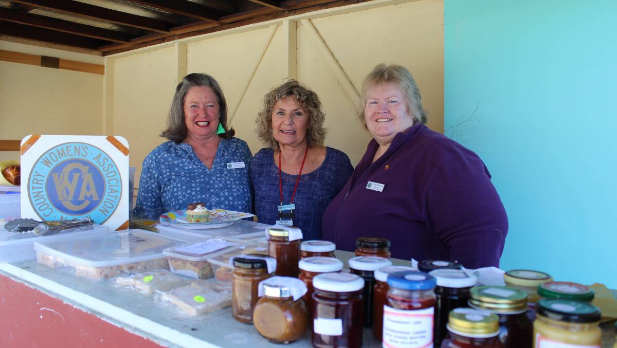 EVERY DOLLAR COUNTS: Helen Galton, Nelleke Gorton and Christine Skeen of the CWA Bega branch support bushfire victims by selling their sweet treats in Bega. 